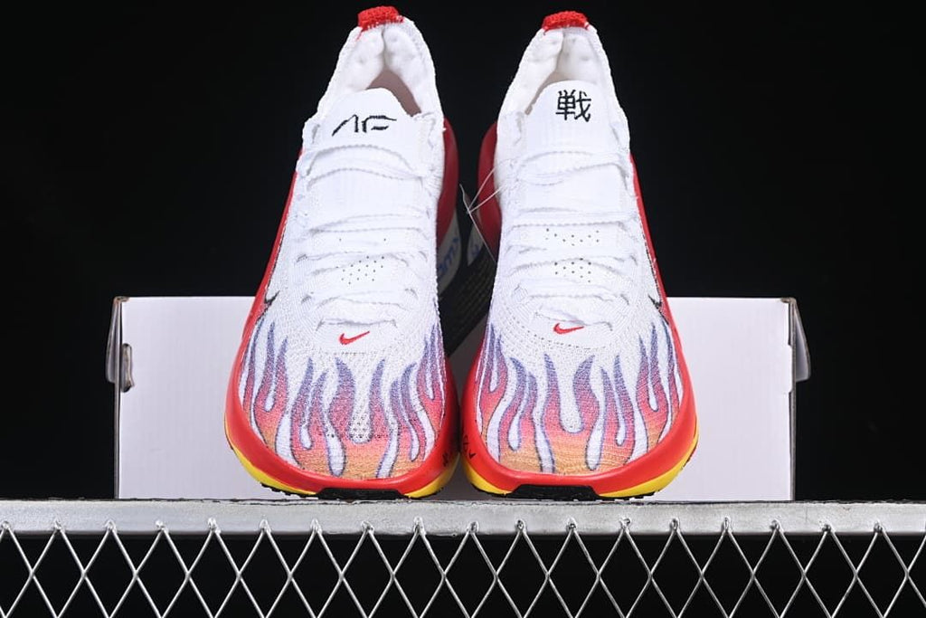 Front view of the pair showing the patterned toes and red and yellow accents