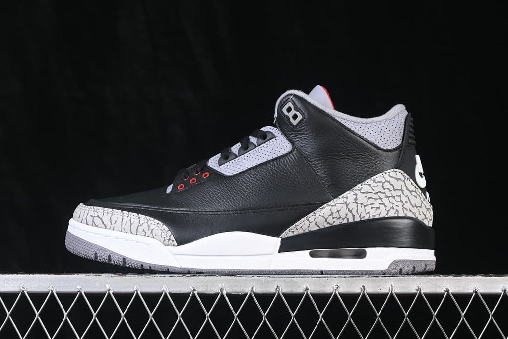 Side profile of the Air Jordan 3 Black Cement sneaker