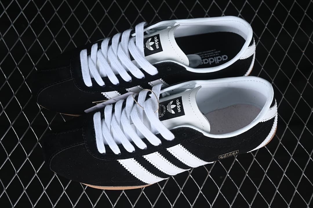 Pair of black and white Tokyo sneakers viewed from above