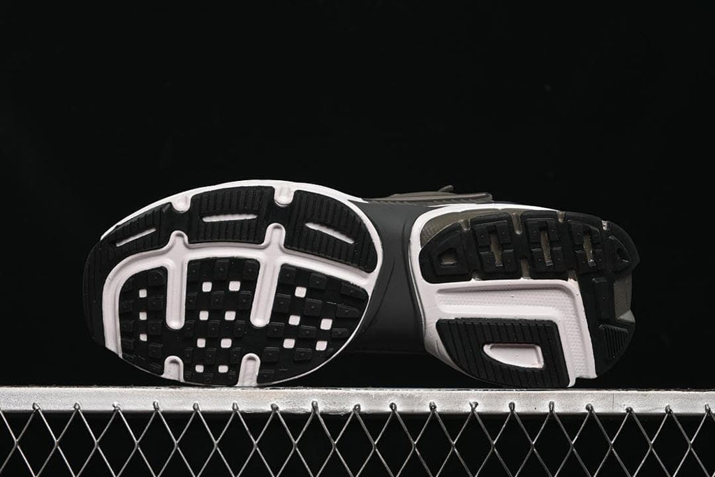 Underside view showing the patterned black, white, and brown outsole