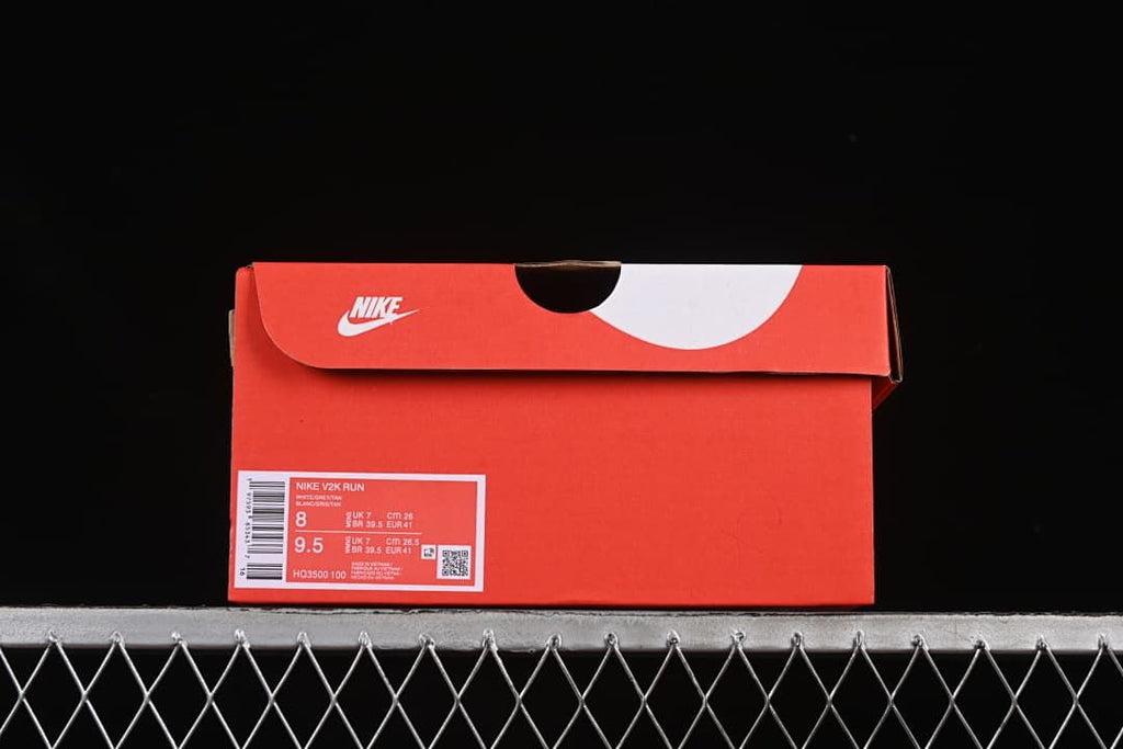 Nike shoe box label showing V2K Run, style code HQ3500-100, and sample size information