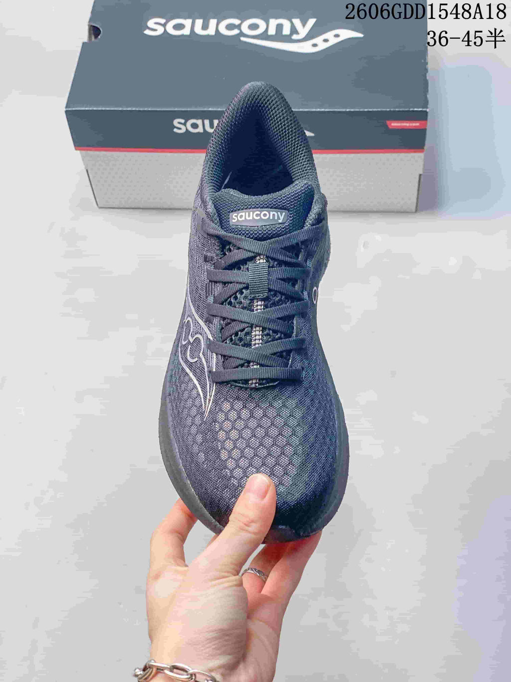 Front view of the Saucony running shoe showing its laces and upper