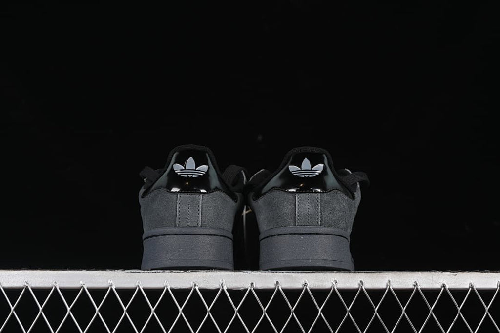 Rear view showing glossy heel tabs and trefoil logos