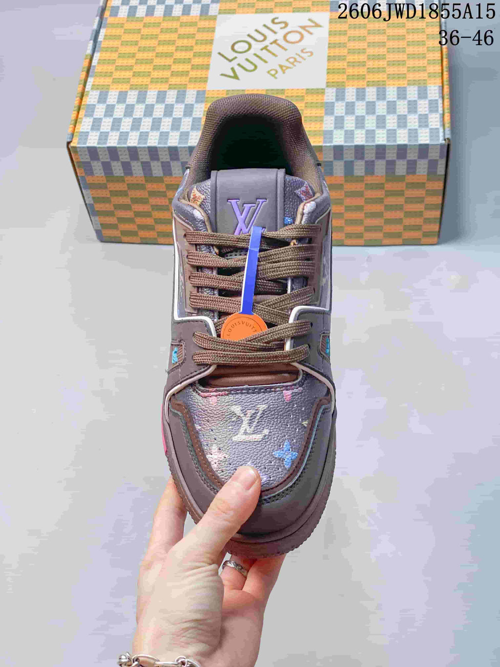 Top view of the sneaker showing brown laces and patterned toe and tongue panels.