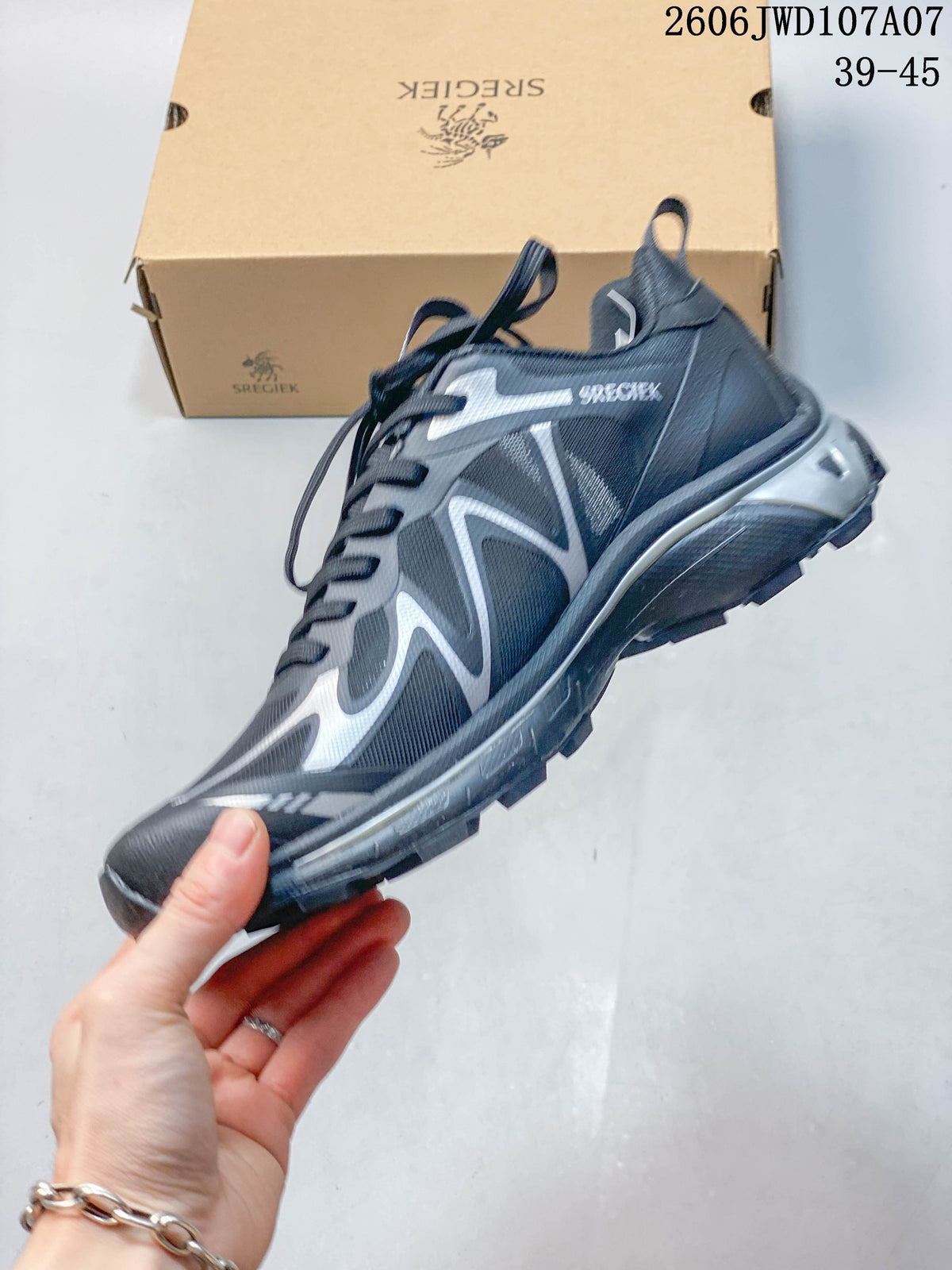 Side view of a charcoal and silver Sregiek low-top hiking shoe