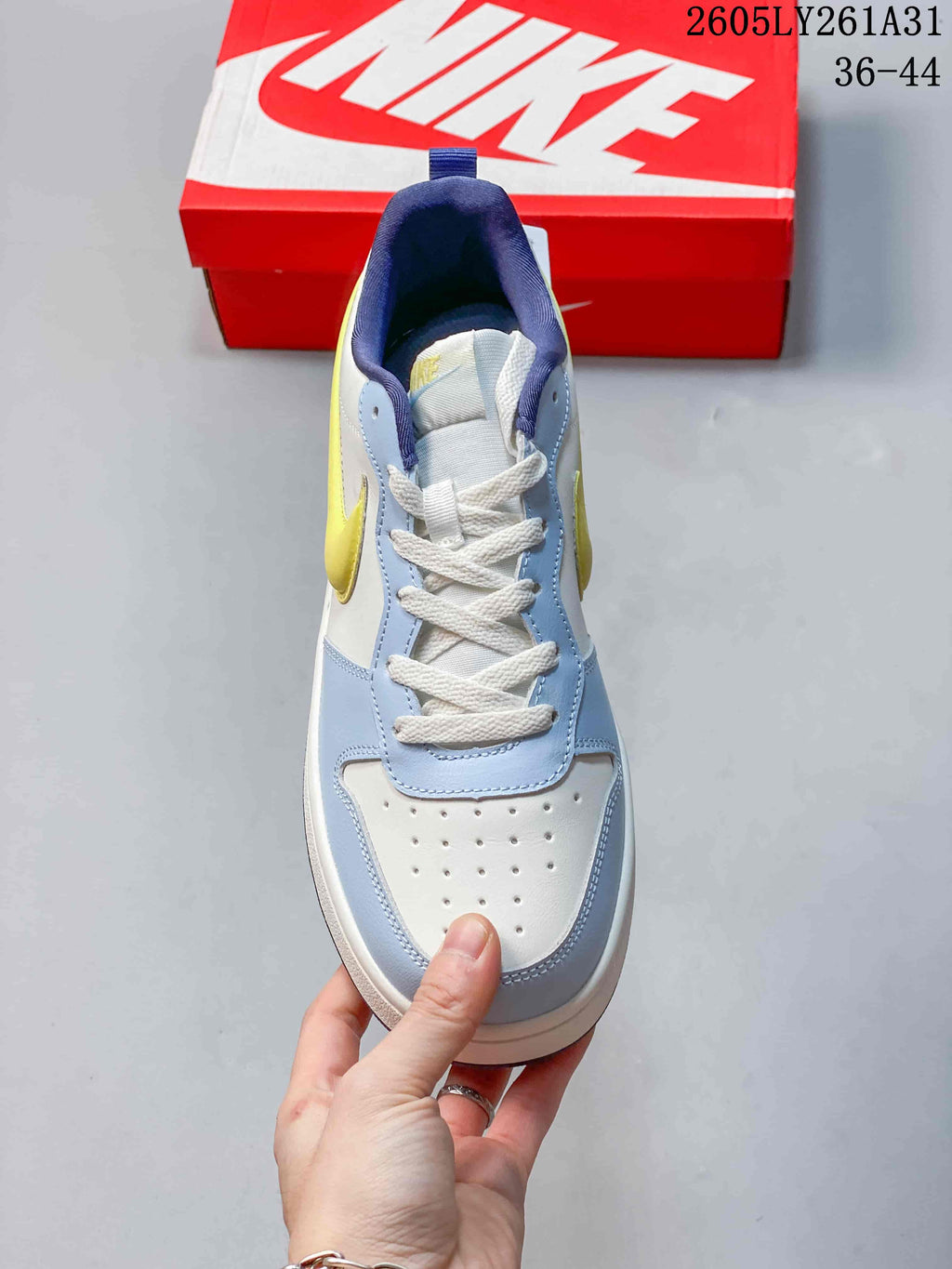 Top view of the sneaker showing white laces and a perforated toe panel