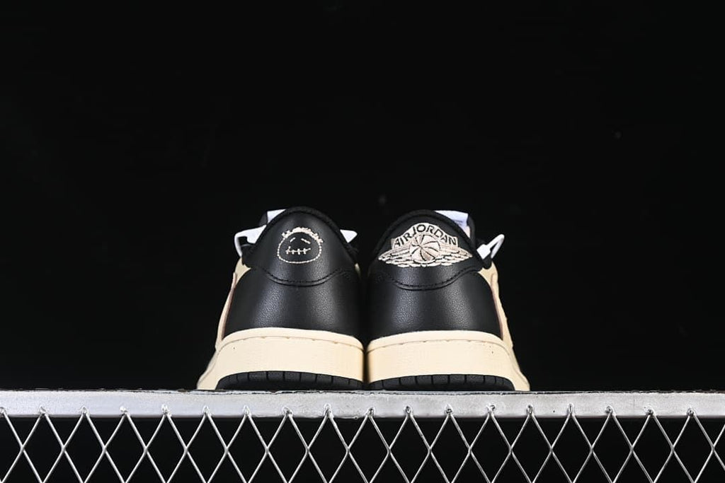 Rear view of both shoes with contrasting heel embroidery