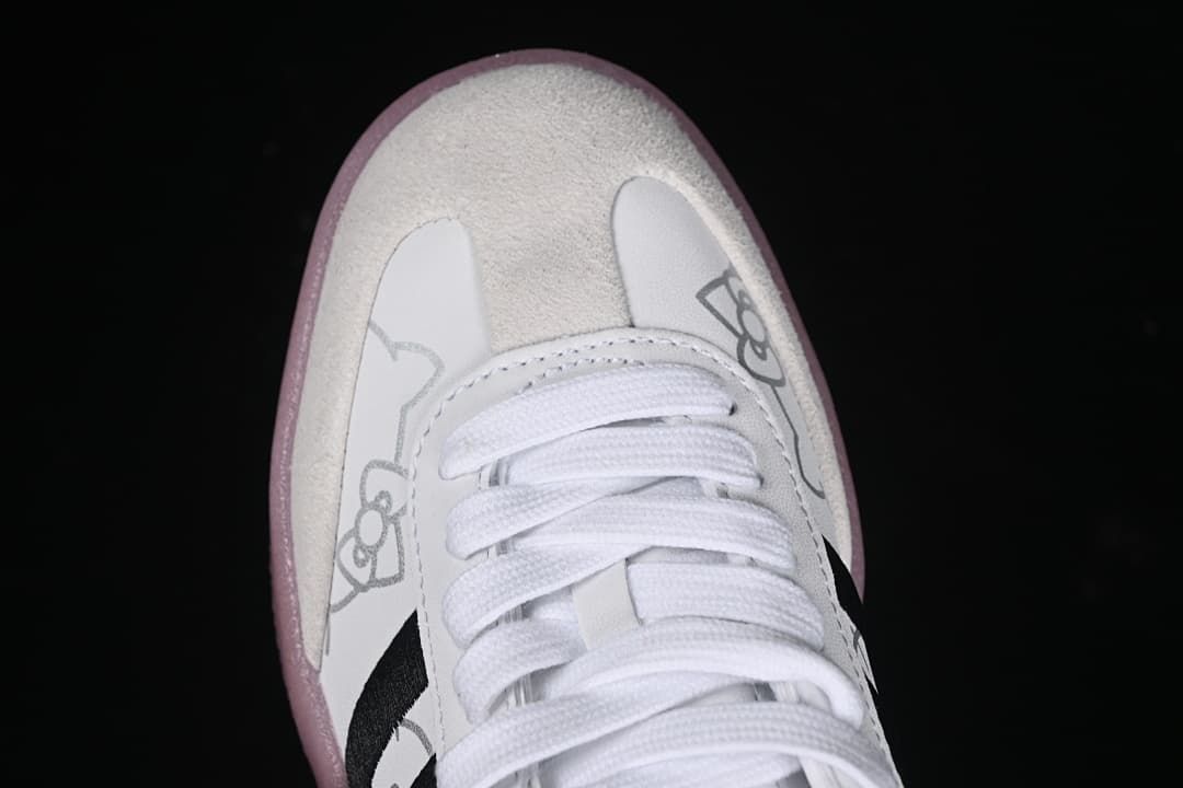 Top-down close-up of the white laces and Hello Kitty graphics on the toe.