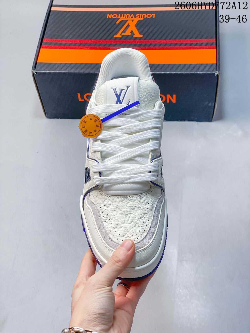 Top view showing the sneaker’s laces and perforated toe
