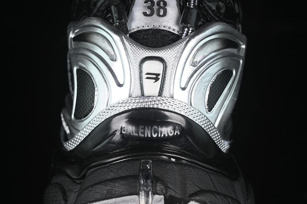 Rear close-up of the sneaker showing silver details and size 38 on the heel.