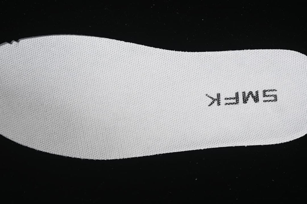 Close-up of the textured insole with SMFK lettering