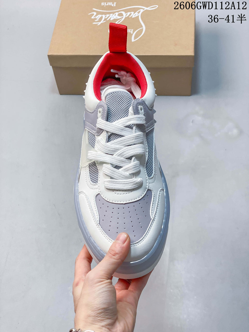 Top view showing the laces, perforated toe panel and red lining