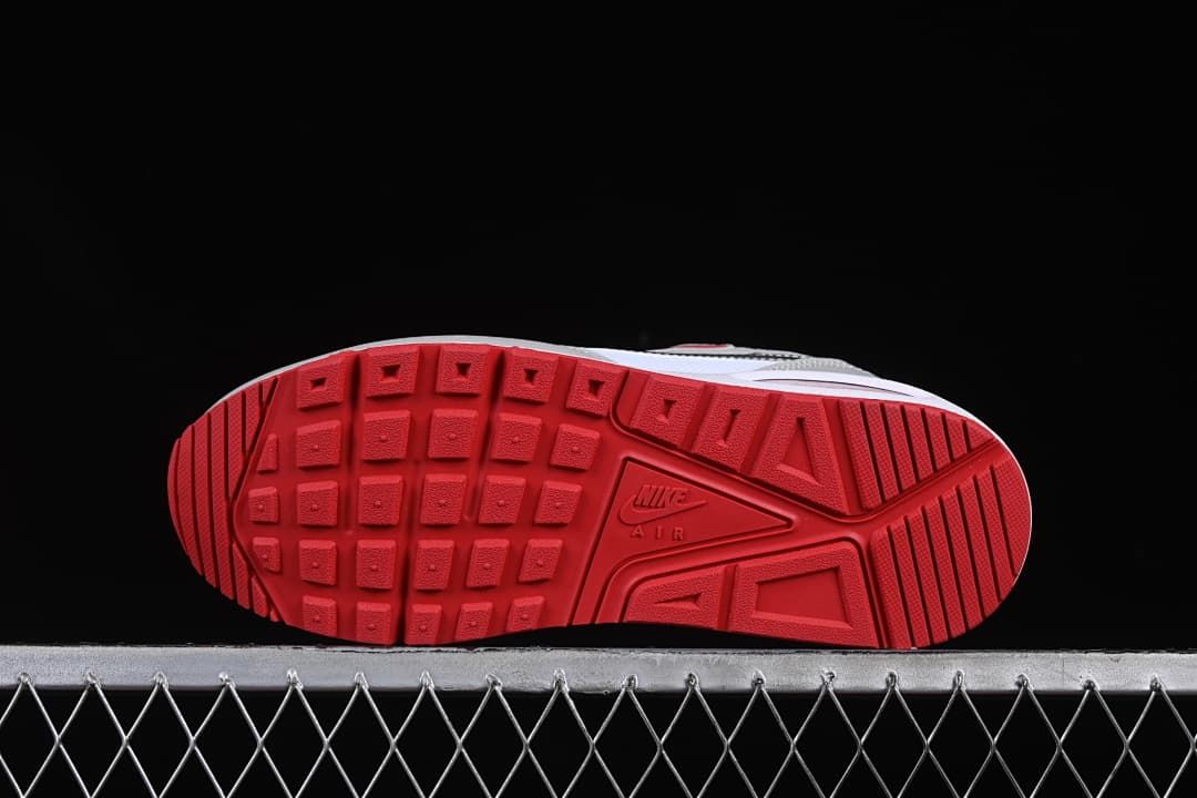 Underside view showing the red patterned outsoles.