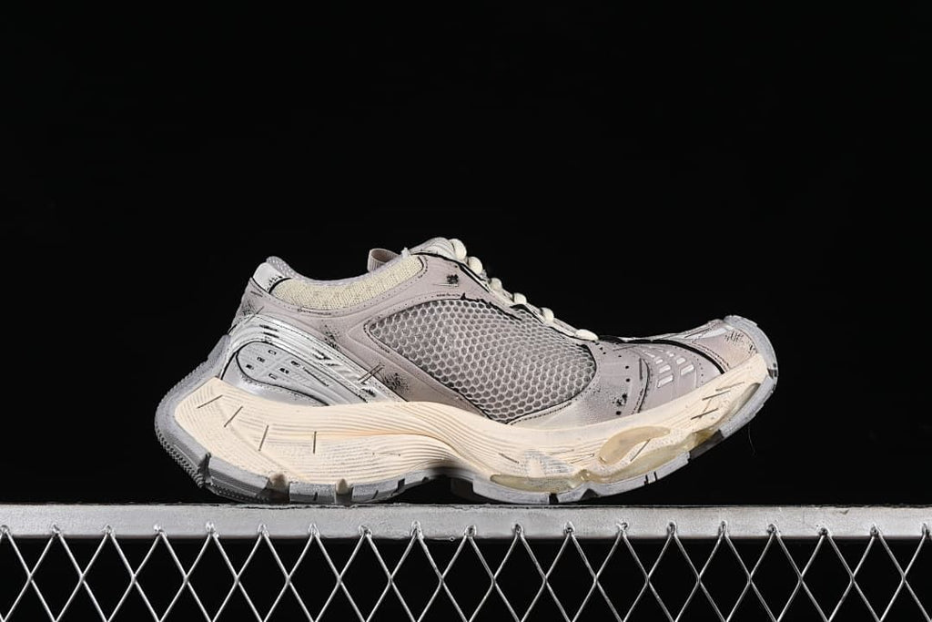 Side profile of a beige and grey Stapler sneaker