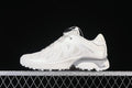 Side profile of light-colored Salomon XT-Whisper sneakers on a dark background