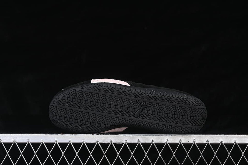 Underside view showing the black outsole and its patterned tread.