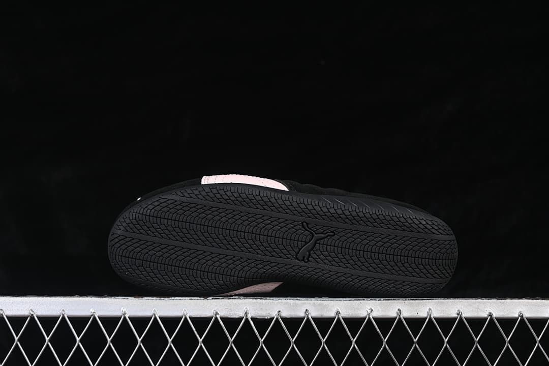 Underside view showing the black outsole and its patterned tread.