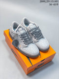 Light gray custom Air Jordan 1 low-top sneakers displayed on an orange Nike shoe box