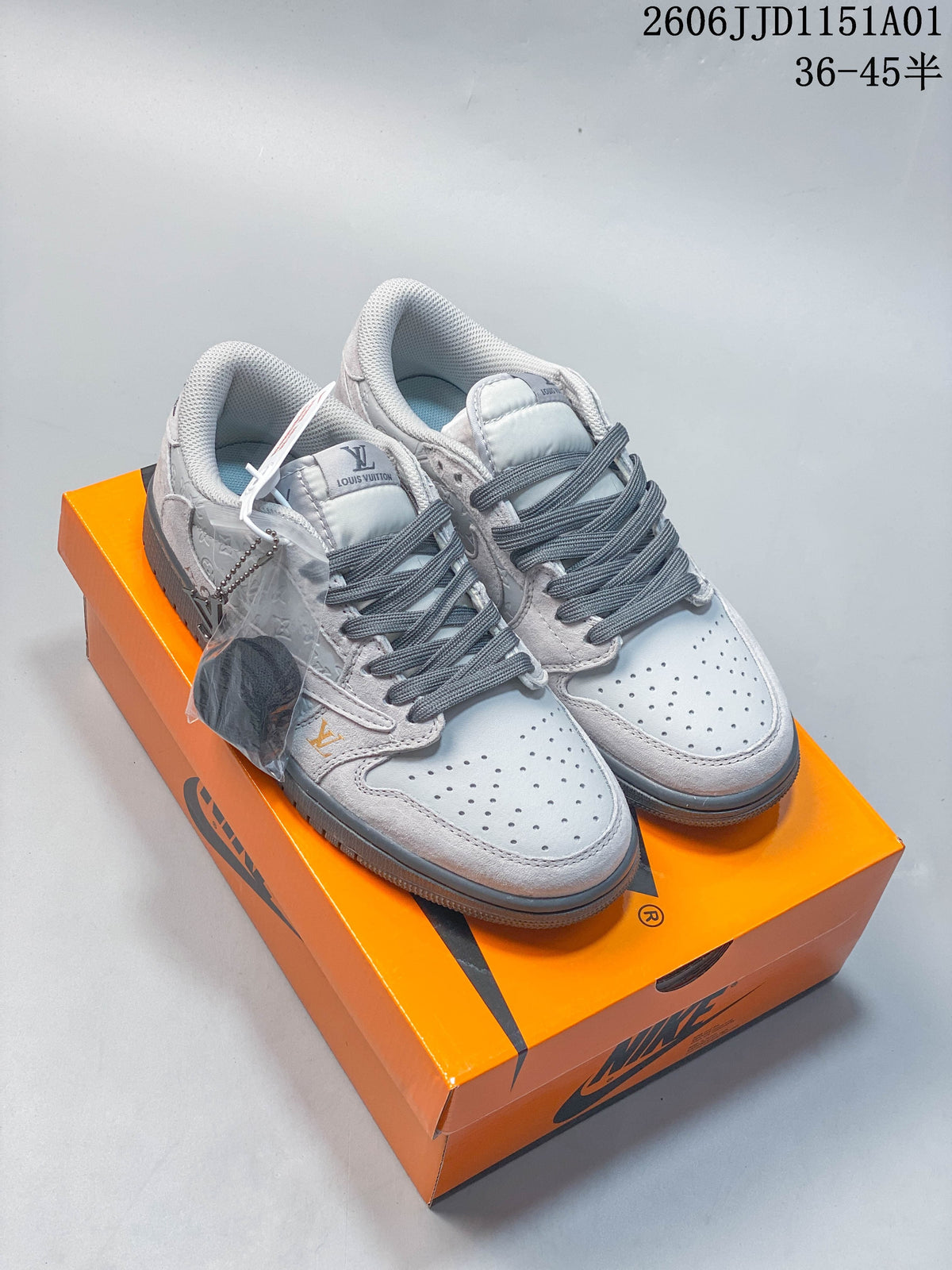 Light gray custom Air Jordan 1 low-top sneakers displayed on an orange Nike shoe box