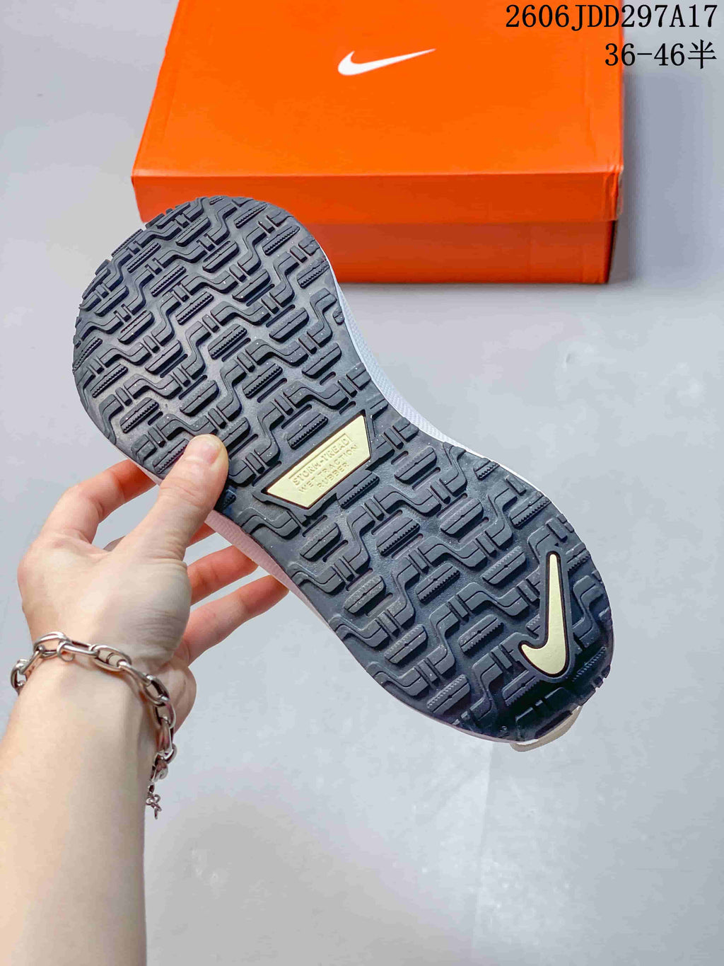 Close-up of the dark patterned outsole of a Nike InfinityRN 4 shoe
