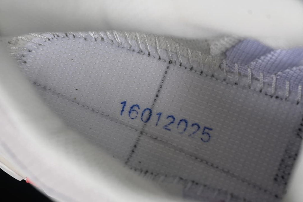 Close-up of stitching and patterned fabric inside the shoe.