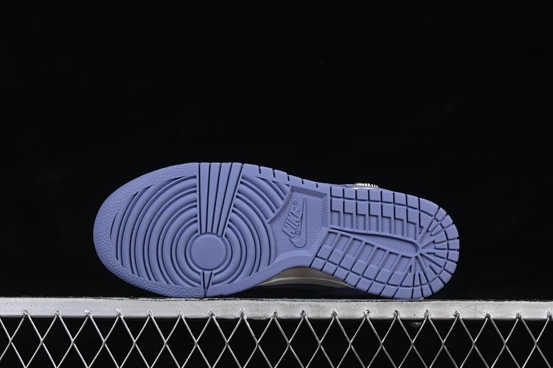 Underside view showing the blue rubber outsole tread