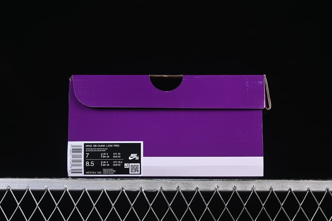 Purple shoe box with a product label showing style code HF3704 100 and sample sizes
