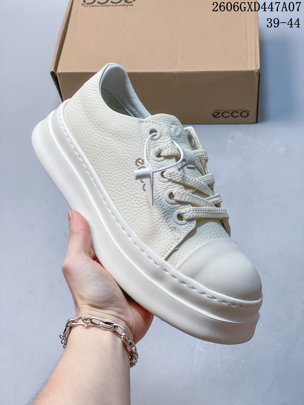Side view of a navy ECCO lace-up sneaker with a light toe panel and thick sole.