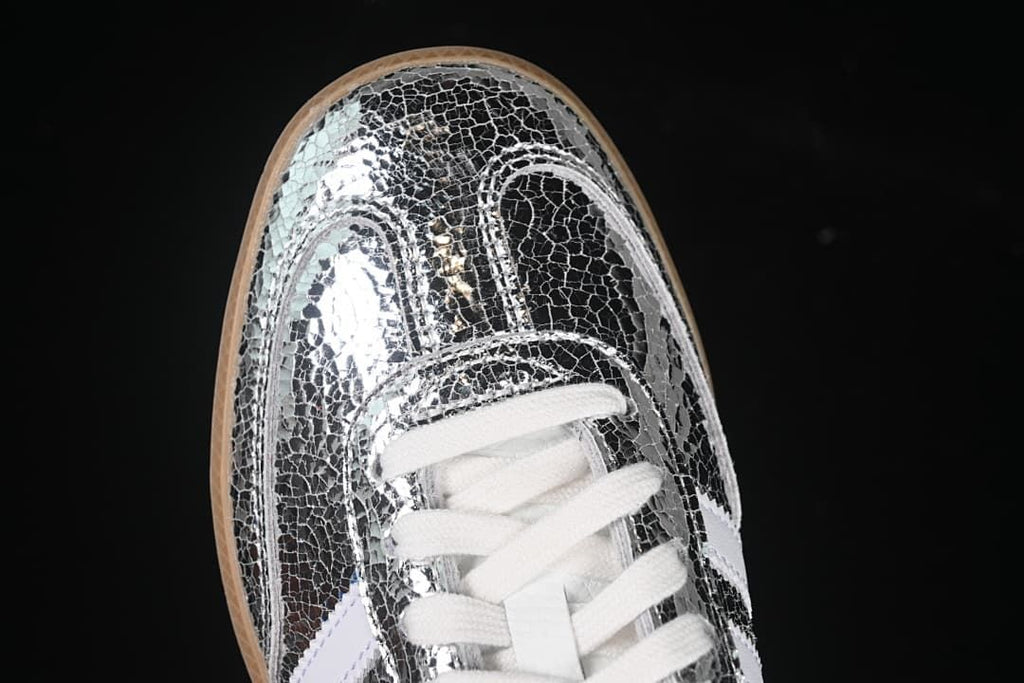 Top view of the reflective patterned toe and white laces