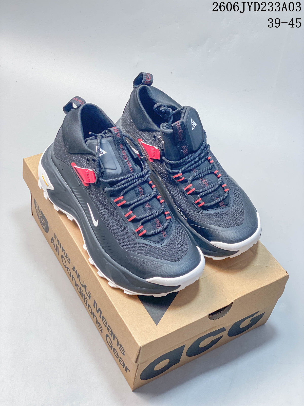 Nike ACG Mountain Fly GTX SE shoes shown in dark gray and black with red accents