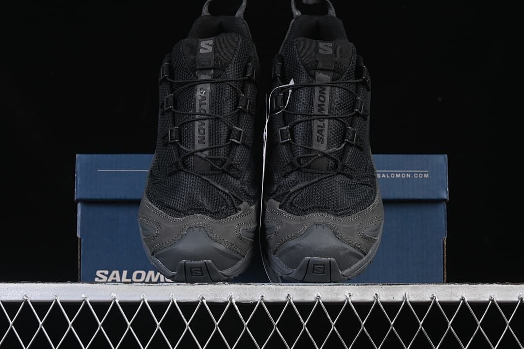 Front view of the pair positioned on a blue shoe box