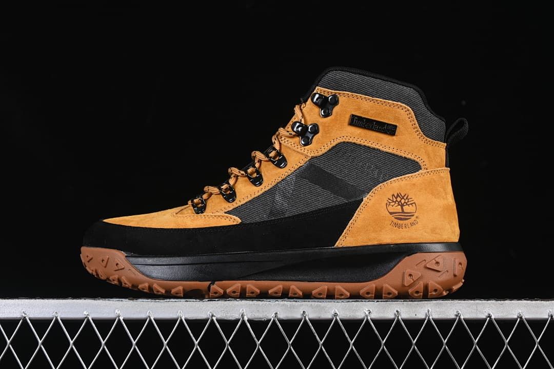 Side view of a wheat and black Timberland high-top boot