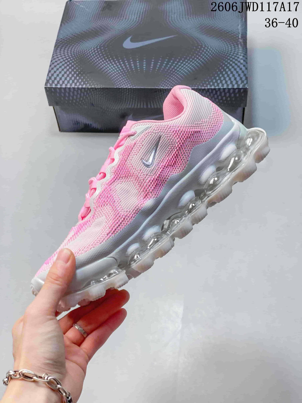 Side view of a pink, white, and gray Nike Air Liquid Max sneaker with visible sole cushioning