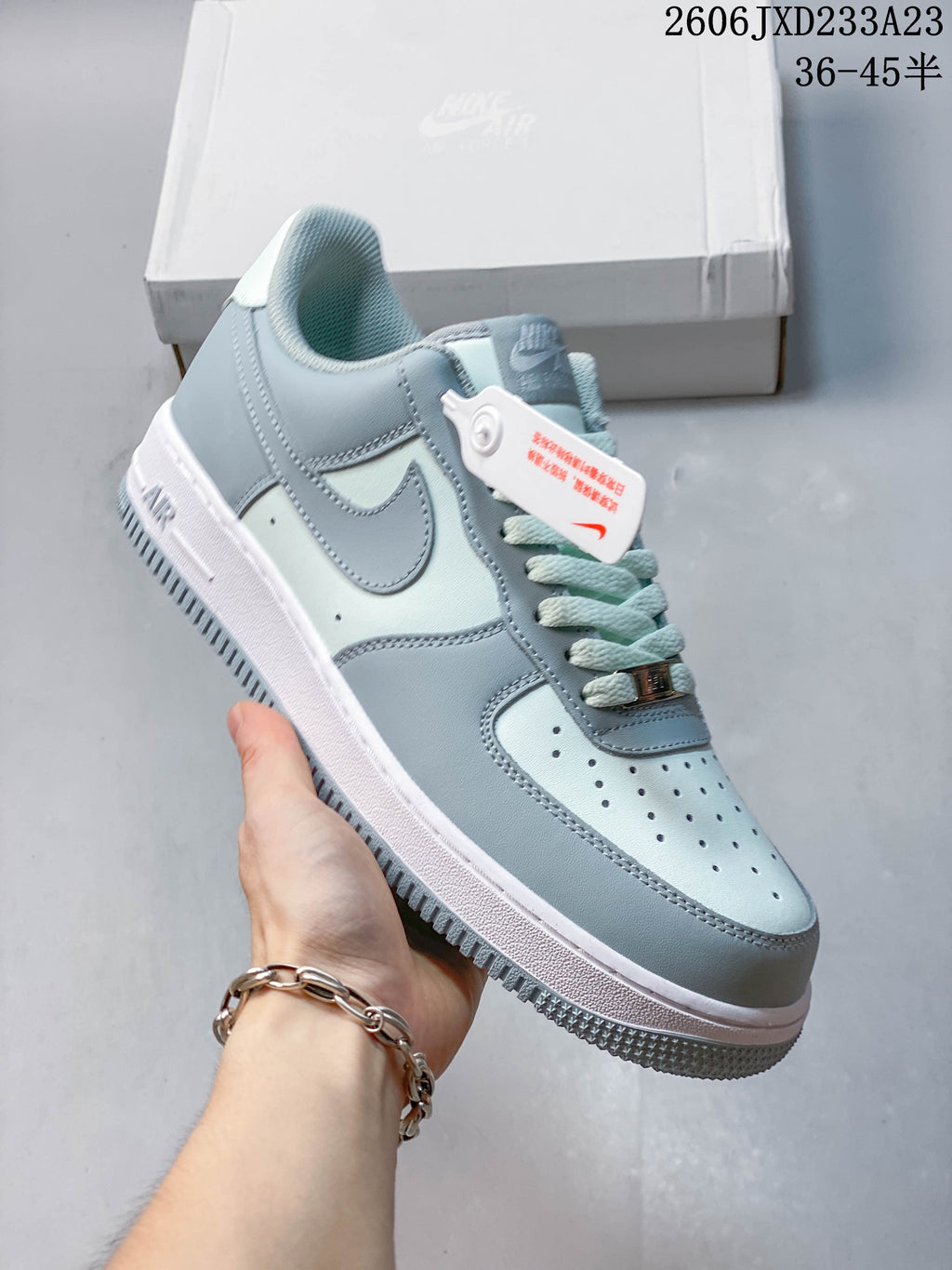 Angled view of a pale blue and white low-top sneaker