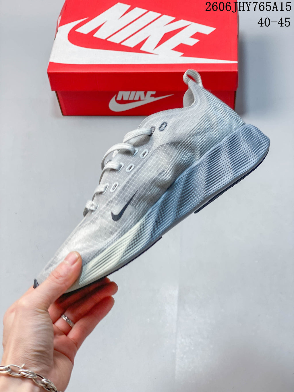 Side profile of the grey Nike Ava Rover running shoe