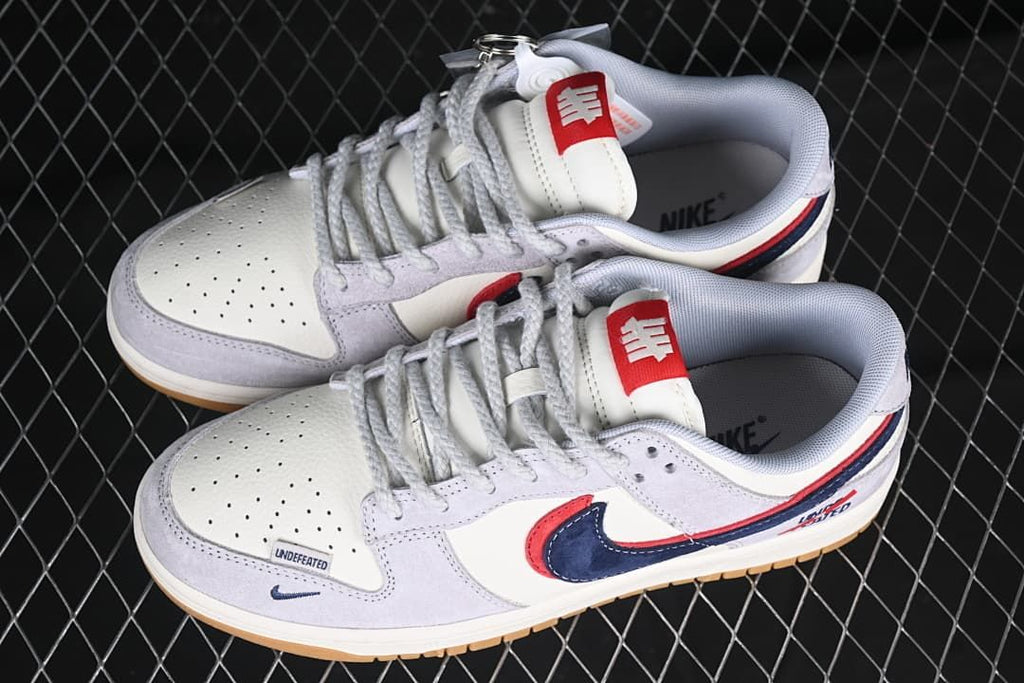 Pair of Nike SB Dunk Low sneakers shown from above at an angle.