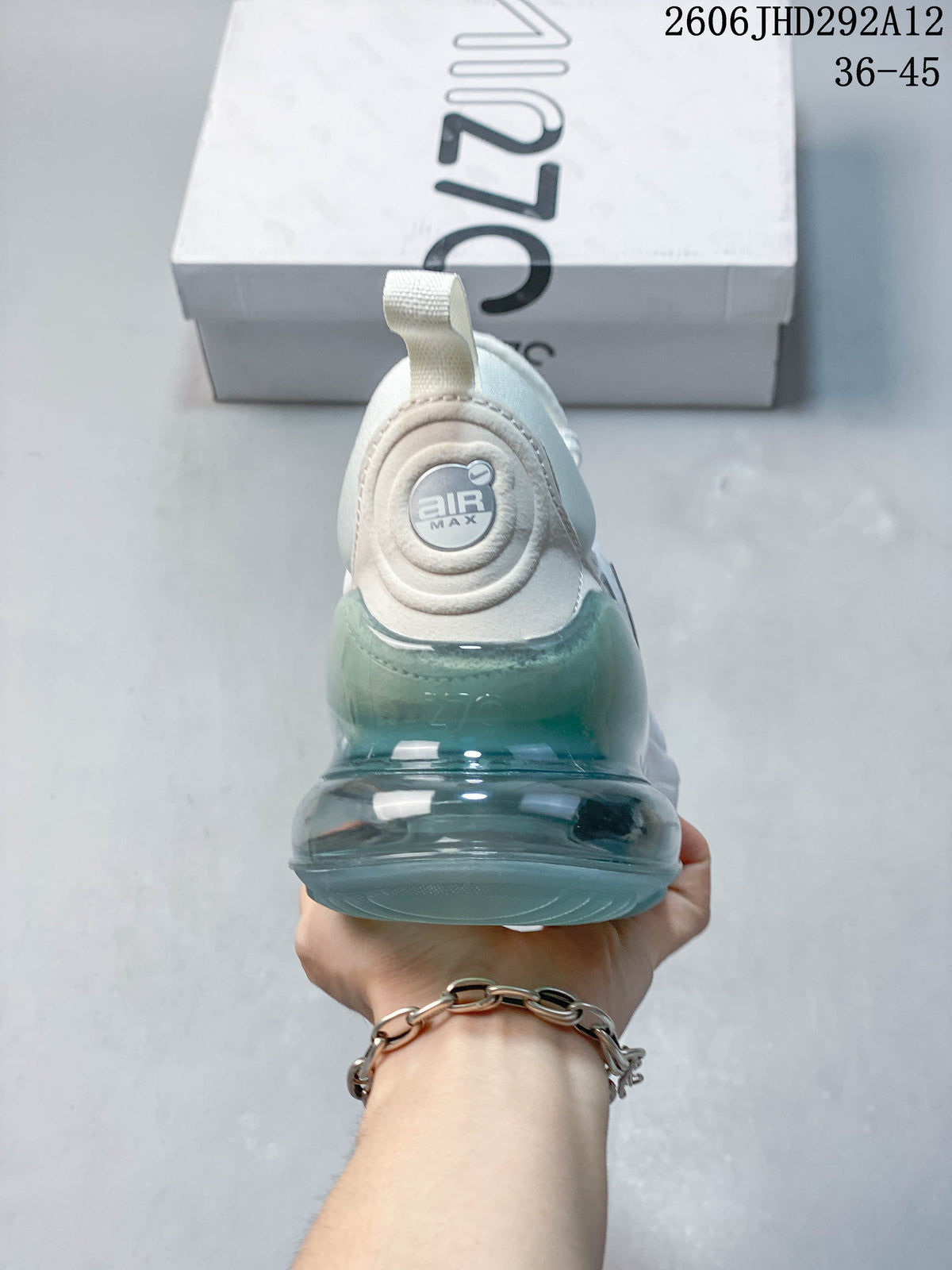 Rear view of the sneaker showing its translucent teal-toned heel unit.