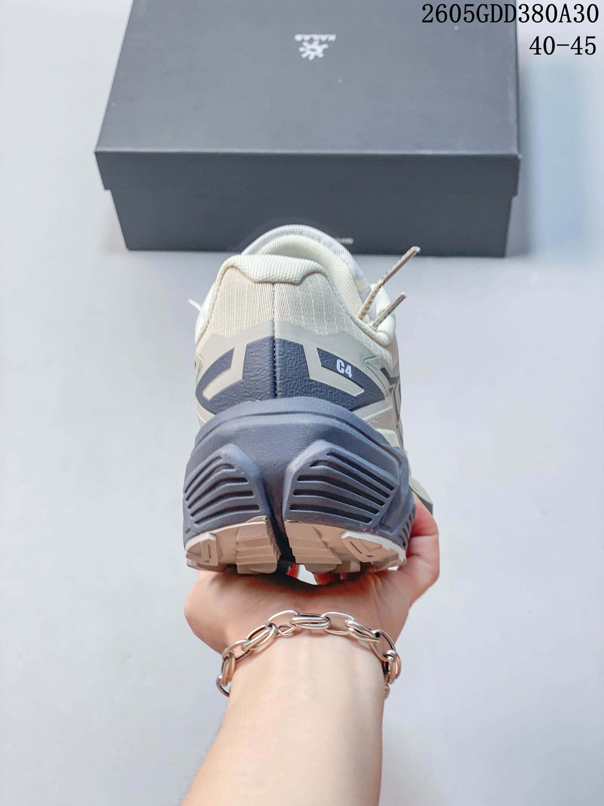 Rear view showing the heel design and outsole lugs