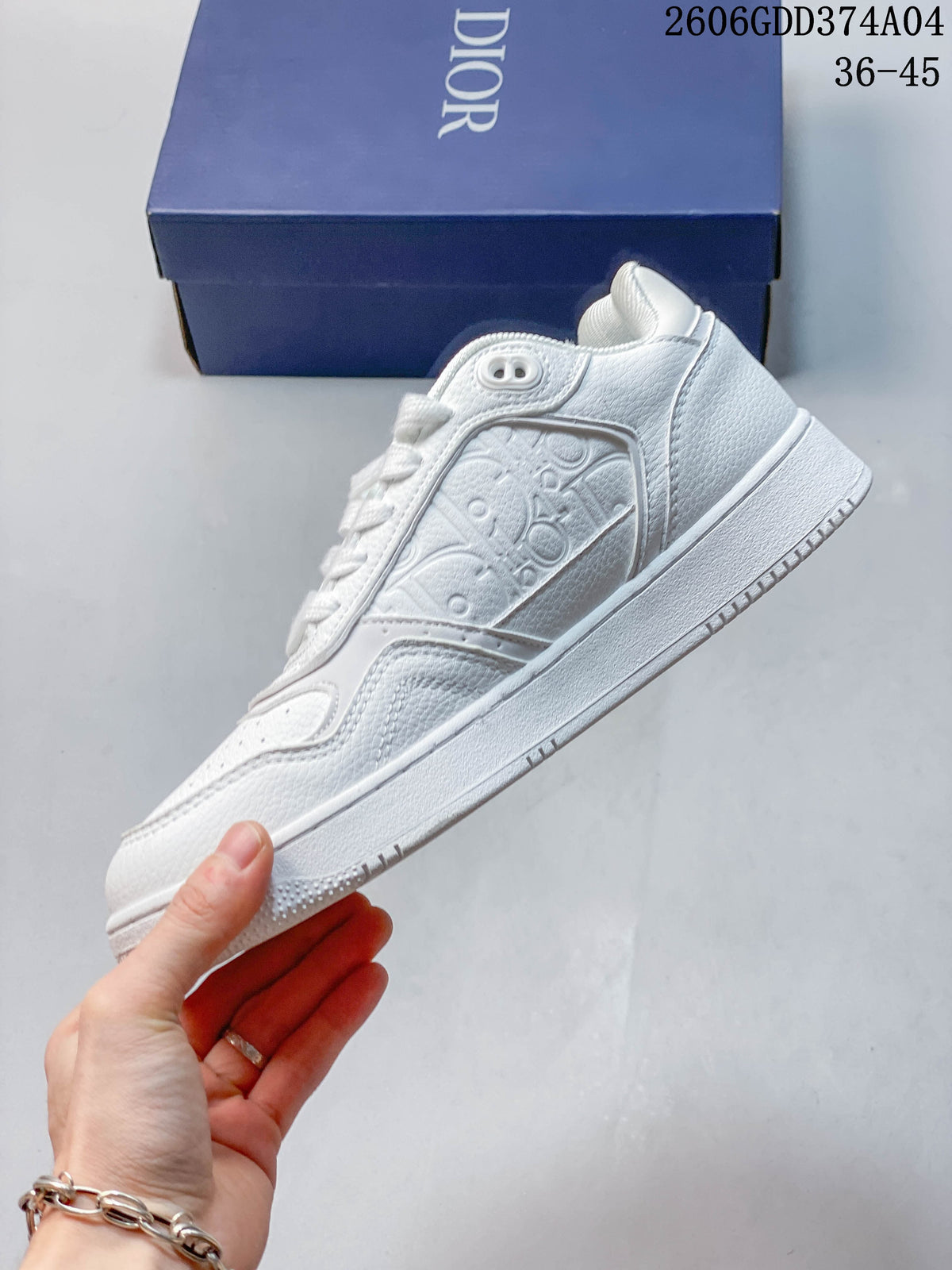 Side view of a white low-top sneaker with patterned panels