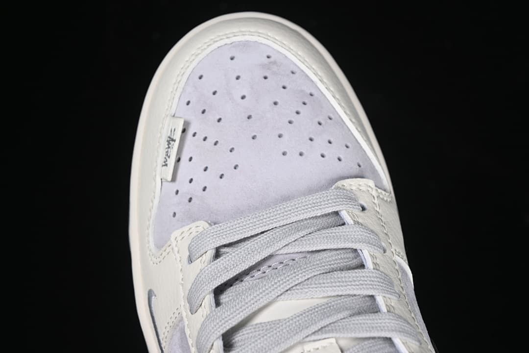 Top view of the perforated light grey toe and laces