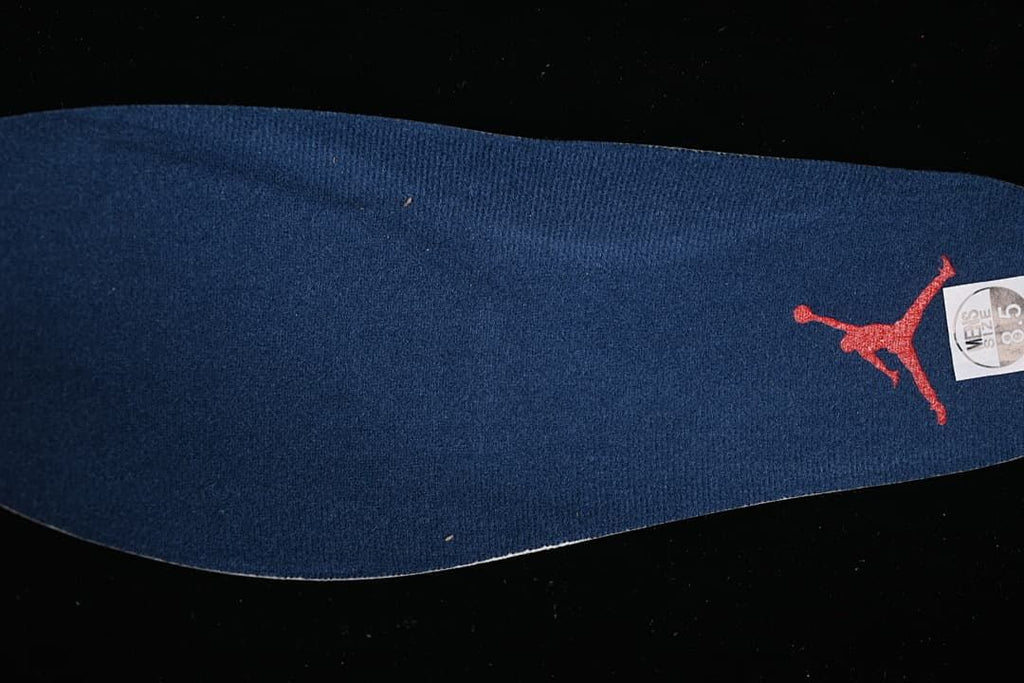 Navy insole with red Jumpman logo and sample size marking