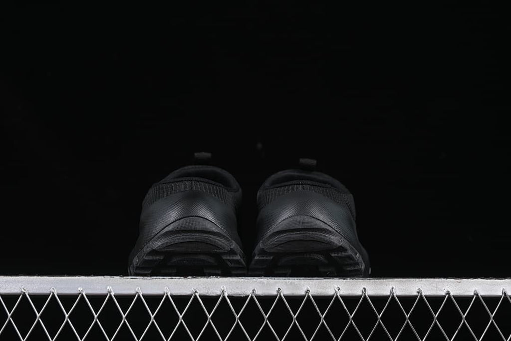 Rear view showing the heel and outsole of both mules