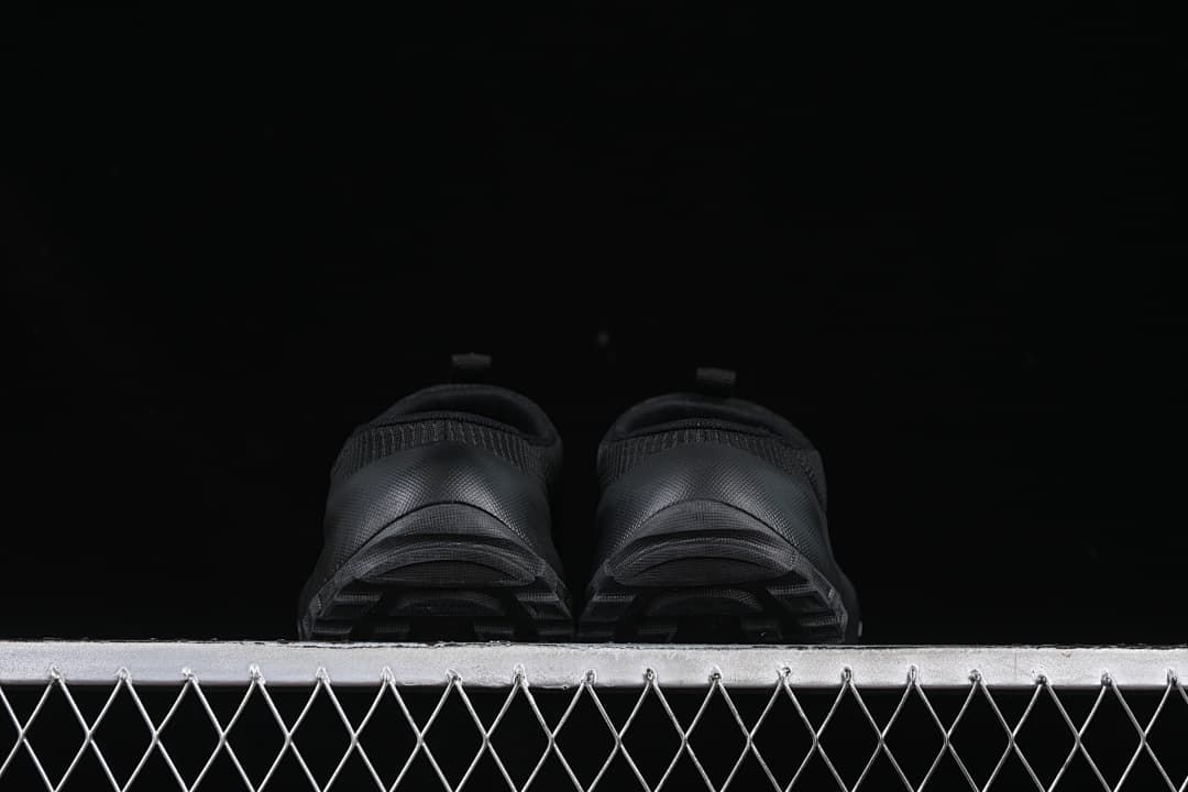 Rear view showing the heel and outsole of both mules