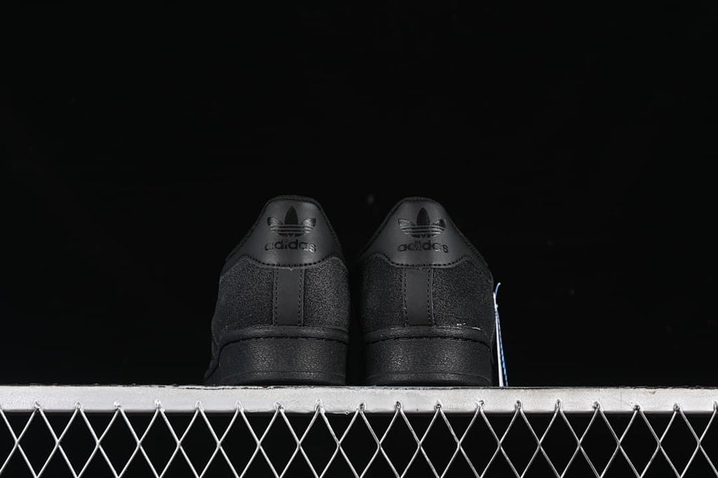 Rear view of the pair with tonal Trefoil heel branding