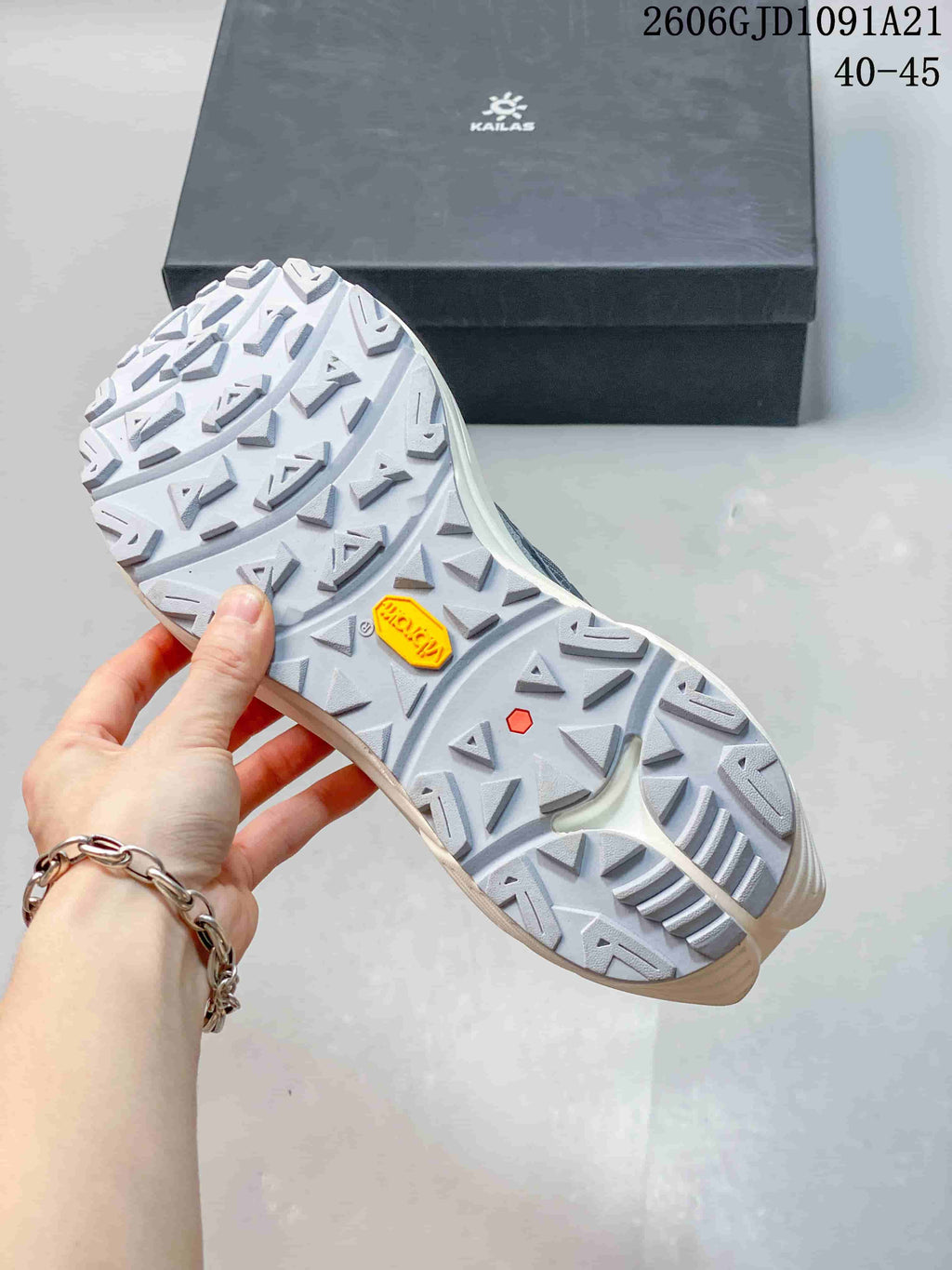 Close-up of the trail shoe outsole showing multidirectional tread lugs
