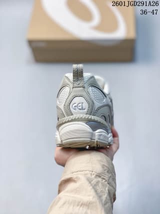 Rear view of the ASICS GEL-NYC RGD sneaker showing the GEL heel detail and layered gray-and-white midsole.