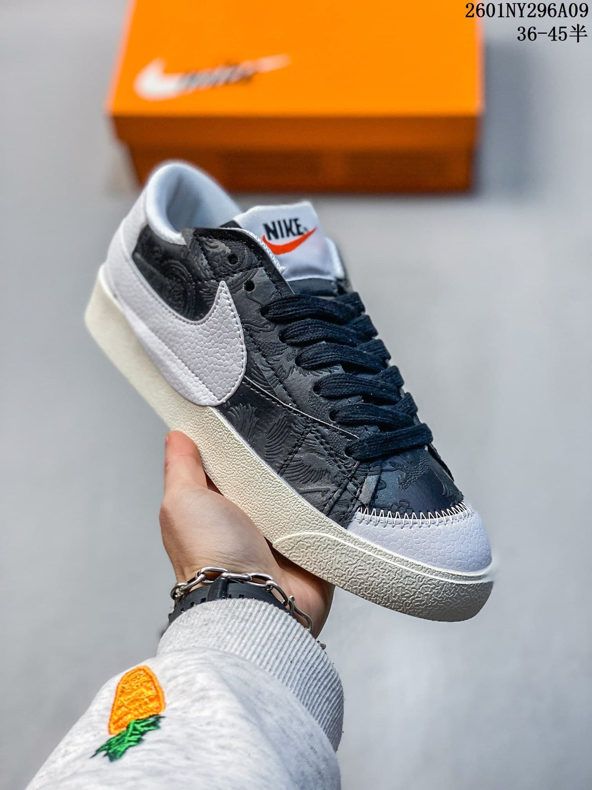 Dark Nike Blazer Low '77 Jumbo sneaker with a white oversized Swoosh