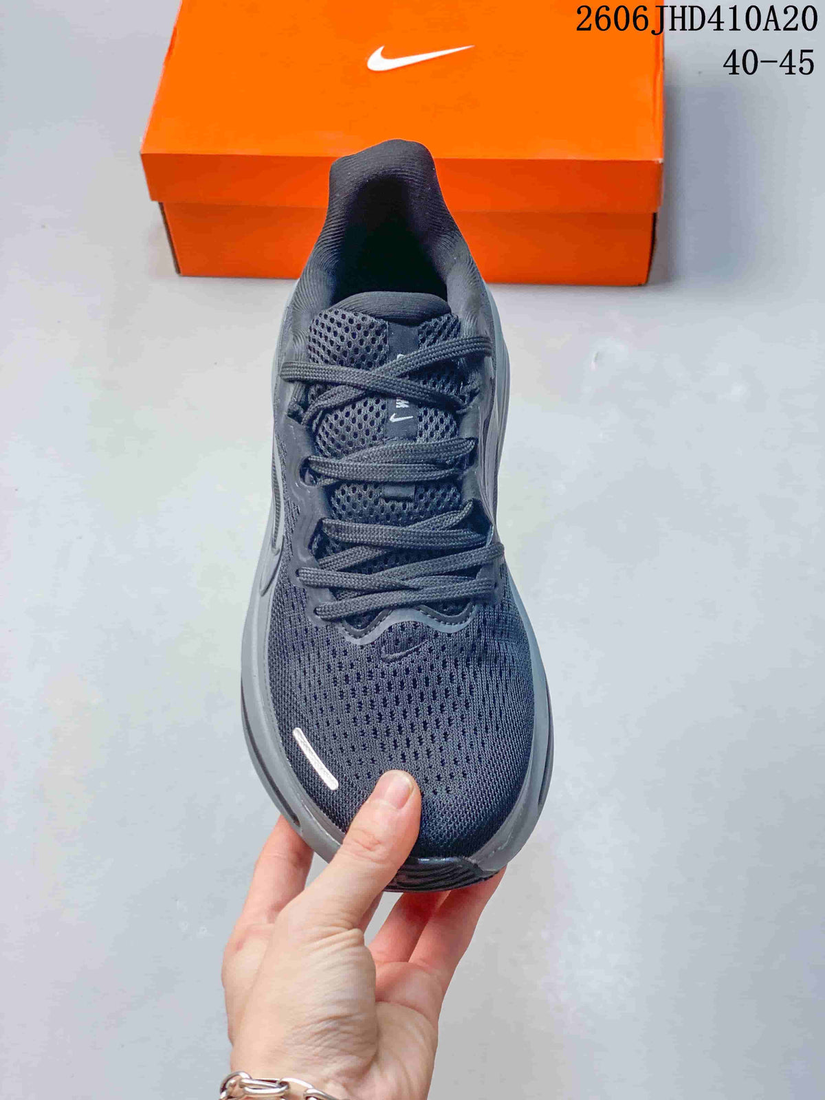 Front view of the laced dark gray running shoe