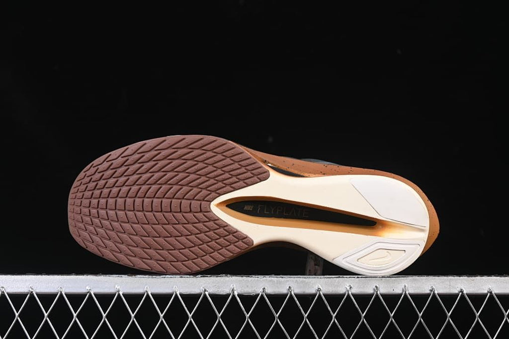 Underside view showing the patterned outsole and central midfoot section.