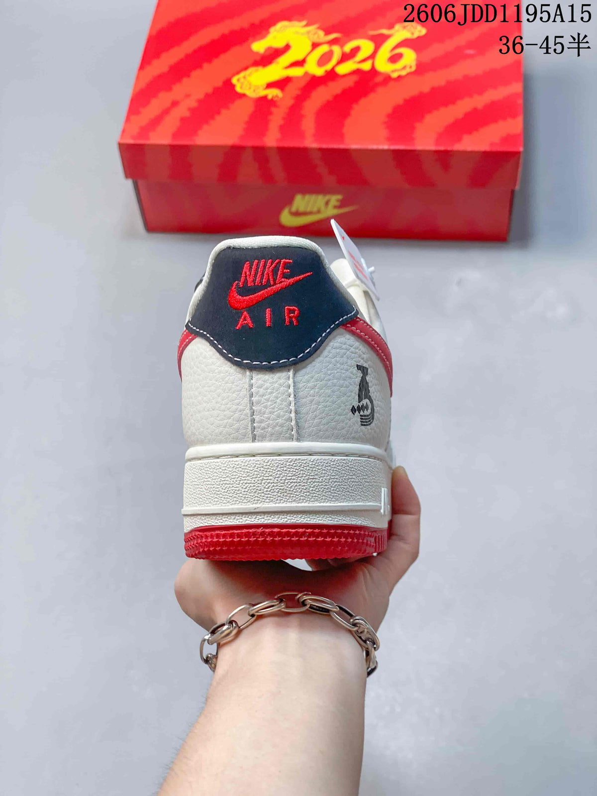 Rear view showing the heel details and red outsole of the white Nike Air Force 1 Low
